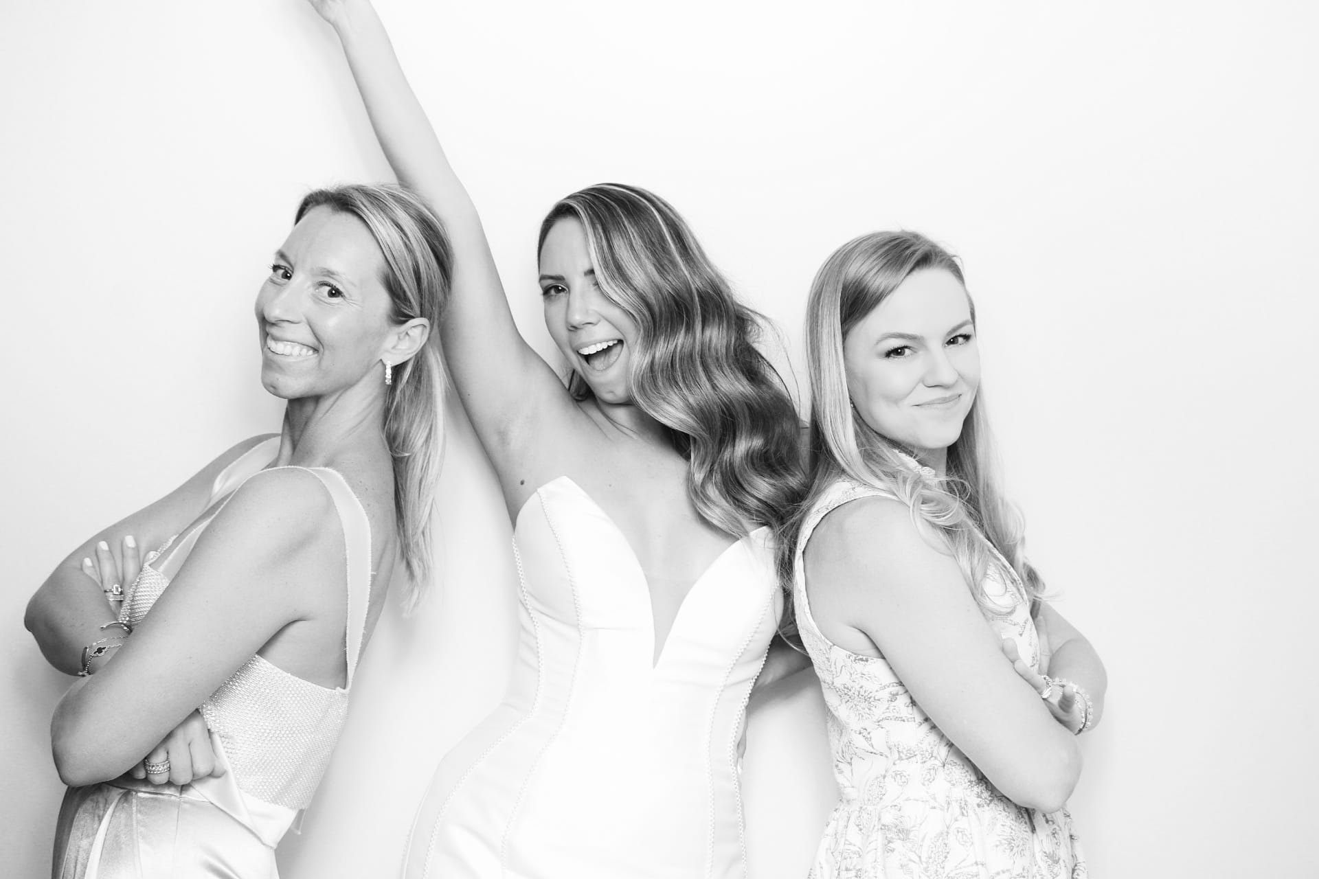 Black and white portrait of three women back to back