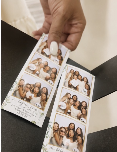 Hand holding printed photo strip keepsakes